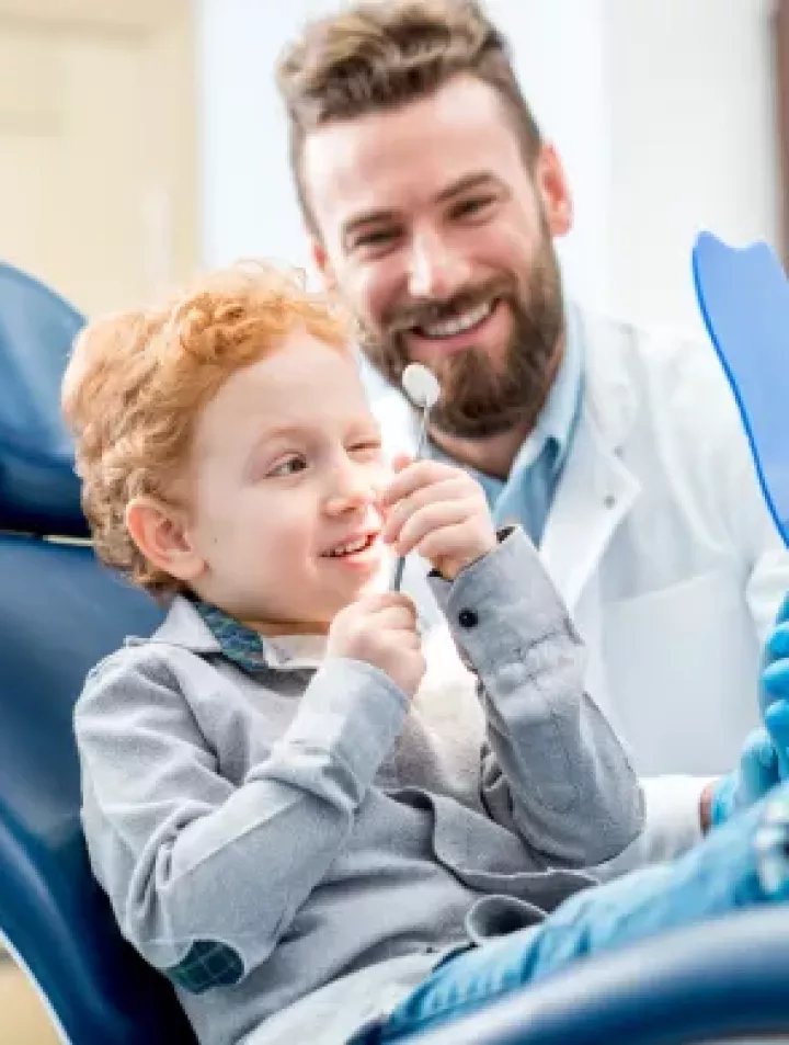 Adult Dentist with Child Patient
